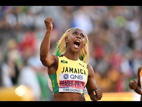 Shelly-Ann Fraser-Pryce celebrates winning the 100m title in 10.67 seconds at the World Athletic Championships at Hayward Field in Oregon on Sunday. 