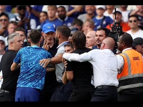 Chelsea’s head coach Thomas Tuchel argues with Tottenham’s head coach Antonio Conte during their English Premier League soccer match at Stamford Bridge Stadium in London, on Sunday.