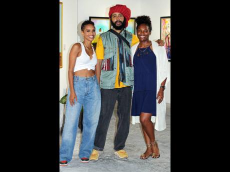 Creative Director at New Wave Lindsey Lodenquai (left), Grammy Award-winning reggae artiste Protoje, and owner of The Sky Gallery Tara Brown (right) took a break from ‘holding a reasoning’ to give our cameras some love.