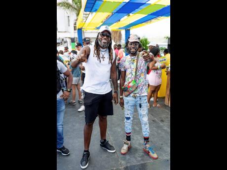 West Indies bastsman Chris Gayle (left) and artiste Junior ‘Tanto Blacks’ Henry were giving ‘real rich’ vibes while out for cricket.