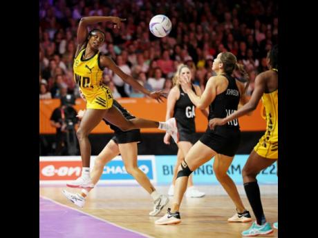 Jamaica’s Jodi-Ann Ward (left) recovers a ball during the netball semi-final match against New Zealand on day nine of the Birmingham 2022 Commonwealth Games at NEC Arena on August 06, 2022 in the Birmingham, England.