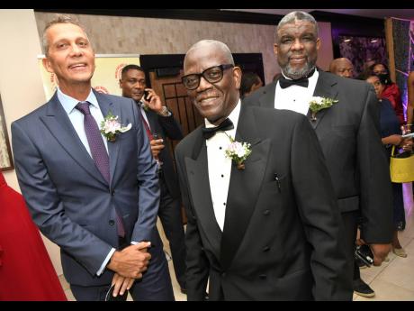 We caught Peter Melhado (left), chairman of Sagicor Group Jamaica, in a chat with Wentworth Charles (centre), board chairman of SERHA, and Errol Greene, regional director of SERHA.