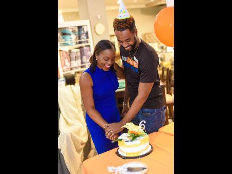 Ashley General Manager Pamille Shaw-Blair and Montego Bay Branch Manager Jason Martin, cut the birthday cake in the second city.