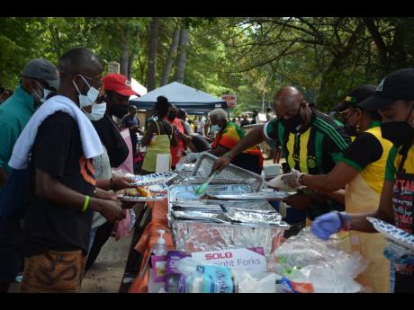 Jerry Dillon, his wife Dawnette Westcarr of ‘No Battle Shall be Fought Alone’ and their friends serve up some of the most delicious Jamaican food at Bear Mountain 2022.