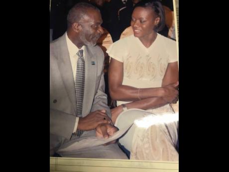 In this undated photo, Don Anderson shares a moment with track star Merlene Ottey.
