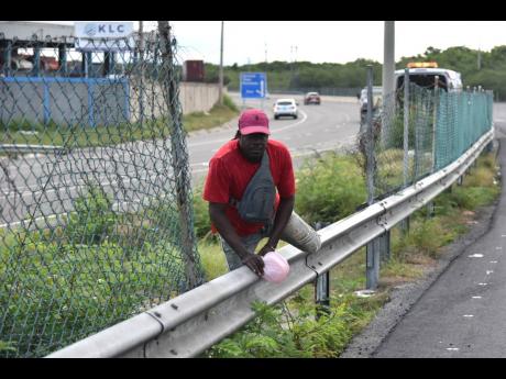 Most problematic is the section at the entrance of the Portmore toll road, opposite the Kingston Logistics Centre, where the perimeter fence is broken down and a footpath created by pedestrians bent on crossing the highway.