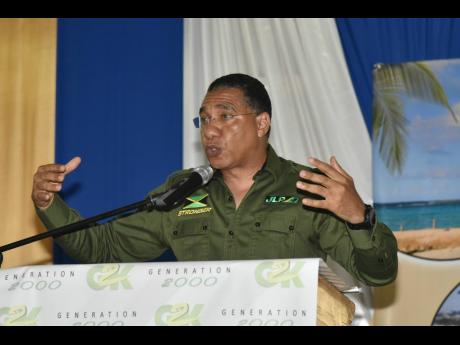 Prime Minister Andrew Holness addresses a G2K Central Executive meeting held at Portmore HEART Academy on Saturday. 