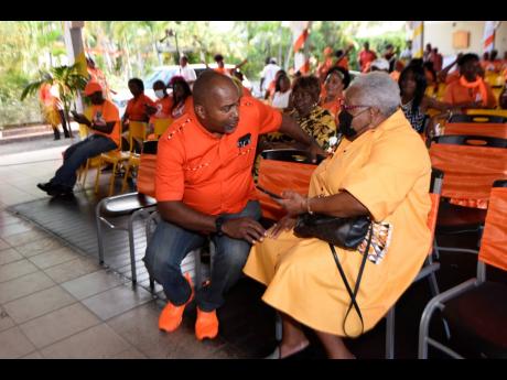 Julian Robinson, member of parliament for St Andrew South Eastern, speaks with Maxine Henry-Wilson, ex-minister of education and former holder of the seat.
They were at a constituency conference meeting at Curphey Place in Swallowfield on Sunday.