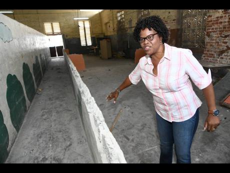 Joset Leslie, principal of Calabar Primary School, shows the space being reconfigured as a multifunctional room, where students will be able to do homework, watch educational programmes, and engage in art and craft and other activities.