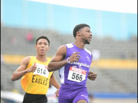 Top junior sprinter Bouwahjgie Nkrumie (right) competing in Kingston College colours at the recent JAAA National Senior and Junior Championship  at the National Stadium.