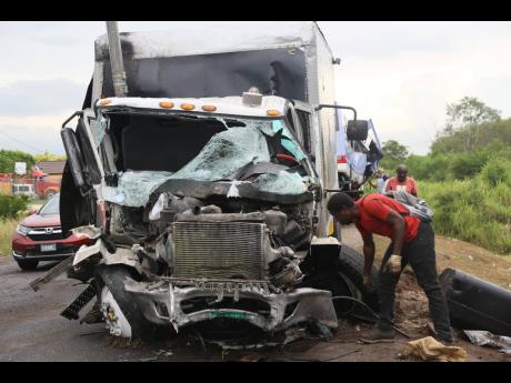 The mangled front of this  International truck is an indicator of the severity of the crash that claimed two lives in Four Paths, Clarendon, Monday.