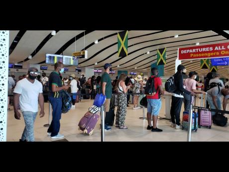 Travellers in the departure area at the Sangster International Airport in Montego Bay.