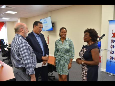 From left: Mark Kerr-Jarrett, chief executive officer, Barnett Tech Park; Homer Davis, minister of state in the Office of the Prime Minister (West); Marlene Malahoo Forte, minister of legal and constitutional affairs; and Gloria Henry, vice-president of BP