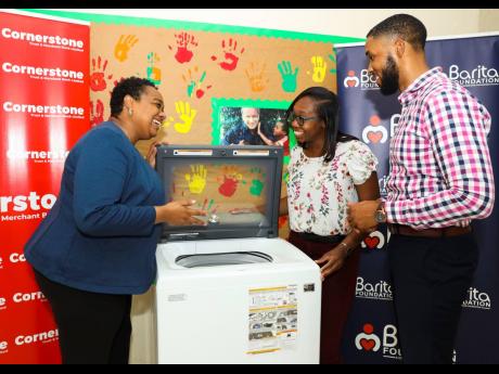 The Barita Foundation donated a washing machine to the SOS Children’s Village in Stony Hill, St Andrew, which provides a loving home for more than 50 vulnerable children who have lost parental care. Barita Foundation Director Carlton Stewart and Programm