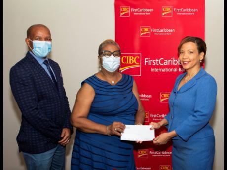 The Best Care Special Education School receives a welcome financial boost to its operational budget from CIBC FirstCaribbean. Here, Annique Dawkins (right), head, corporate banking, CIBC FirstCaribbean, presents a cheque to Lorna Mae Welsh, principal of th