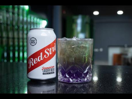 Purple Rain – a playful summer beer cocktail that takes its bright colour from a mixture of blue curacao and raspberry syrup. 