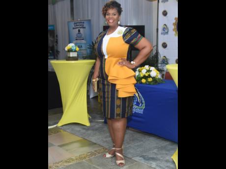 La Sonja Harrison pauses for a smile during the Jamaica Teachers’ Association 58th annual conference.