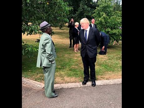 Albert Jarrett chats with British Prime Minister Boris Johnson