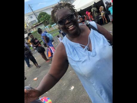 Overjoyed by the work Popcaan is doing for the parish of St Thomas, Morant Bay resident Paulette Stewart, who attended the off-to-school Fun Day with her granddaughter, was all smiles.
