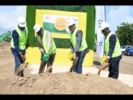 Prime Minister Andrew Holness (second left) is joined by (from left) Keon Hinds, managing director of NF Barnes Construction; Fitz Jackson, member of parliament for St Catherine Southern; and Sylvester Tulloch, vice-chairman, Housing Agency of Jamaica, in 