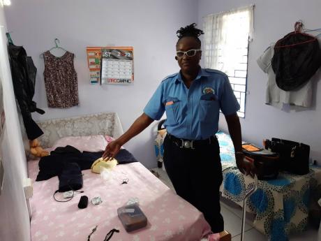 For seven years, District Constable Karen Samuels lived at the Fletcher’s Land Police Station in Kingston; its barracks served as her bedroom, the two guard rooms her living and dining quarters. Seats in the reception area served as her sofa.