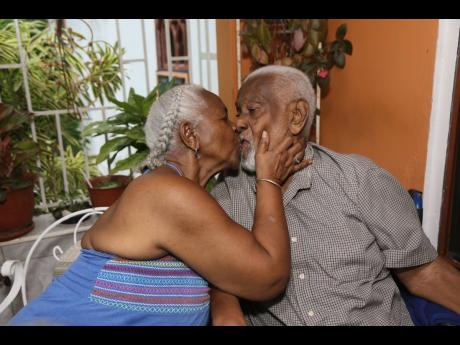 Willard ‘Tony’ Thompson and his wife, Deyon Madge, share a kiss as they celebrate their diamond wedding anniversary in Santa Cruz on August 25. Resisting their parents’ wishes, they eloped 60 years ago.