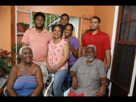 Lovebirds Willard and Deyon Madge Thompson are joined by family on their 60th anniversary on Thursday, August 25. Daughter Nichole (centre) is flanked by grandchildren (from left) Domenick Barnes, Malachi Burke, Sarah Burke and Willard Thompson III.