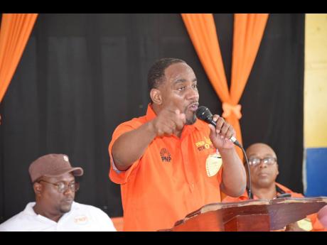Kern Spencer addresses the audience at a People’s National Party Region Five meeting at Brompton Primary School in St Elizabeth on Sunday.
