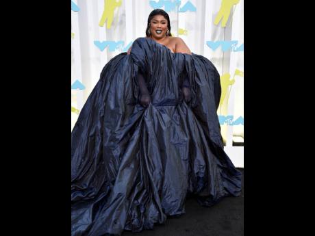 Wearing three looks in one night, Lizzo walked the black carpet in haute couture Jean Paul Gaultier by Glenn Martens, with gloves by Lael Osness and jewellery by Jennifer Fisher.