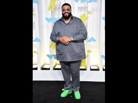 DJ Khaled wore a grey Prada outfit and neon-green Nike sneakers. 