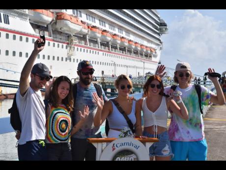 Passengers arrive on the ‘Carnival Sunrise’, the first cruise vessel to visit Jamaica following the resumption of cruise tourism, at the Ocho Rios Cruise Terminal in St Ann on August 16, 2021.