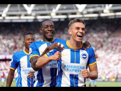 Brighton and Hove Albion’s Leandro Trossard (right) celebrates scoring against West Ham United during the English Premier League  match at London Stadium, London on Sunday, August 21.