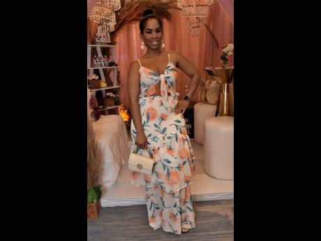 The lovely Peta-Gay Foster attended the nuptial affair in this fabulous floral design.