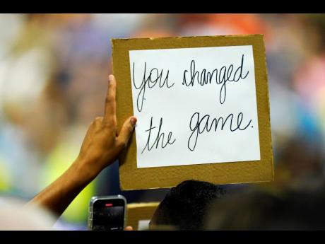 A fan holds a sign for Serena Williams, of the United States, after she beat Anett Kontaveit, of Estonia, in the second round of the US Open tennis championships on Wednesday in New York.