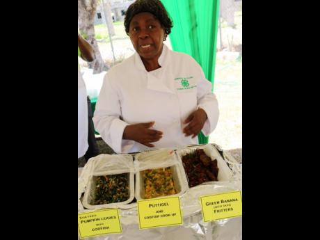 Sylvia Porteous, home economics specialist with the Jamaica 4-H Clubs speaks about the different items on the menu including stir fried pumpkin leaves, puttigel and green banana (with skin) fritters.
