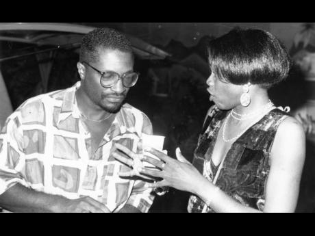 May 9, 1994: FAME’s Francois St Juste listens to a point being made by Jennifer Grant, RJR’s News and Current Affairs Editor.