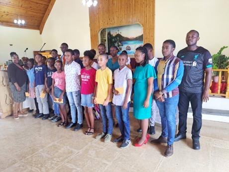 The 17 beneficiaries who were presented with gift packages by the Rejorn Campbell Love Foundation on August 28.