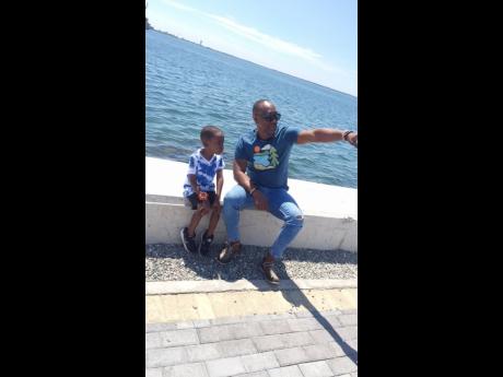 Amir and his father, Andrew Nembhard, spending quality time by the water front, in downtown, Kingston.