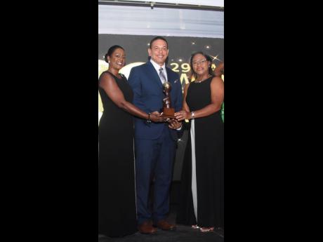 Half Moon copped the award as Jamaica’s Leading Luxury Resort at the 29th Annual World Travel Awards at Sandals Montego Bay on Wednesday night. The recipients are Sharon Logan (left), director of sales marketing; Stefan Steer, director of engineering; an