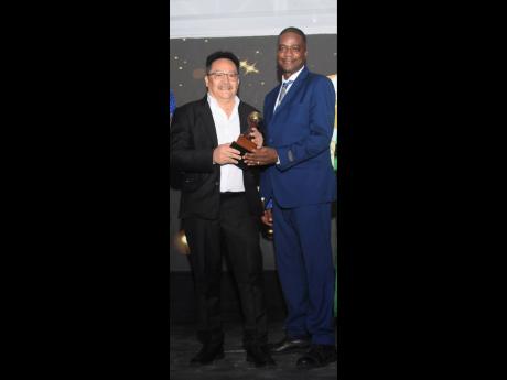 Dave Chin-Tung (left), CEO of Go Jamaica Travel, and Robert Ferguson, sales manager, were among the major winners, copping four awards.Dave Chin-Tung (left), CEO of Go Jamaica Travel, and Robert Ferguson, sales manager, were among the major winners, coppin