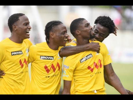 Colorado Murray  (second right) celebrates with his Harbour View teammates after scoring the opening goal in the July 3  Jamaica Premier League final at Sabina Park.