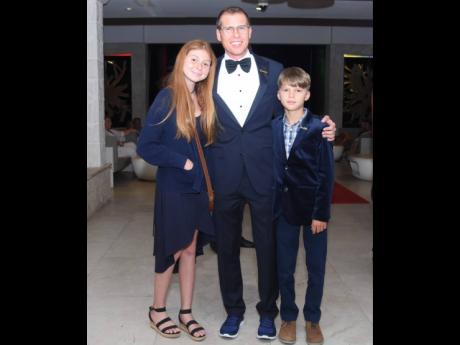 Chairman of Sandals Resorts International, Adam Stewart, shares lens with niece Penelope-Sky McConnell and son Aston Stewart at the 29th World Travel Awards on Wednesday. 