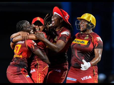 Jamaica's Natasha McLean (right) celebrates victory with (from left) Kyshona Knight, Anisa Mohammed and Lee-Ann Kirby as the Trinbago Knight Riders won the inaugural Hero Caribbean Premier League Women's title on Sunday at Warner Park Sporting Complex in B