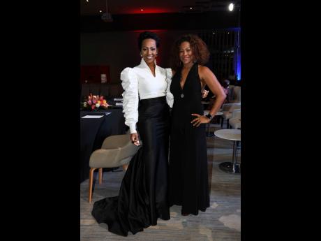 Angelie Martin-Spencer (left), Miss Jamaica Universe 1994, paired her white Yolvinta blouse with a black Drenna Luna pants, while Dr Saphire Longmore, Miss Universe Jamaica 2000, went all-black in a Ralph Lauren jumpsuit.