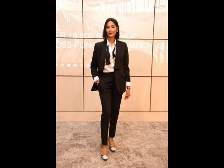 Hema Luxe Director Emma Subratie went rogue in her tux-inspired pants suit, but added flair with her bejewelled emerald-green pumps.