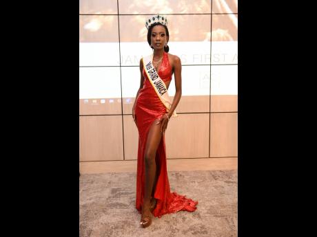 Miss Grand Jamaica Kim-Marie Spence made a fiery entrance in her red Monte Claire dress.