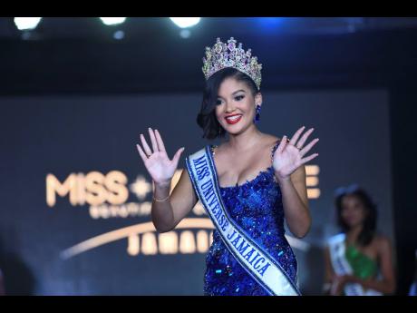 Miss Universe Jamaica 2021 Daena Soares waves to the audience after taking her last walk as queen. 