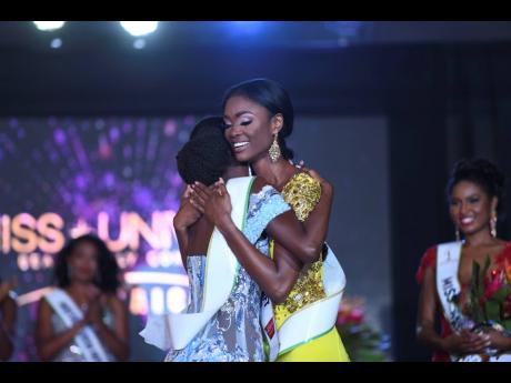 Miss Universe Jamaica 2022 Toshami Calvin (right) is embraced by first runner-up, Rachel Silvera. 