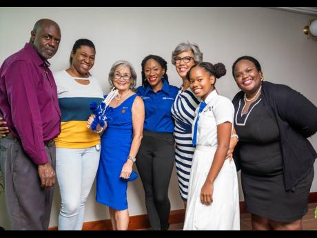 Howard and Michelle Gordon (left), father and sister of late ICHS students Kimberley and Jhenaè, at the handover ceremony on July 20, with this year’s grant recipient Grade 11 Hannah Hepburn (second right) from ICHS. Kim Mair (third right), president; L