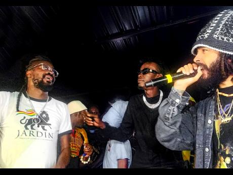 Dancehall’s Beenie Man is welcomed on stage by Protoje, as Chi Ching Ching looks on during Send Off Party held at Di Lot on Monday. 